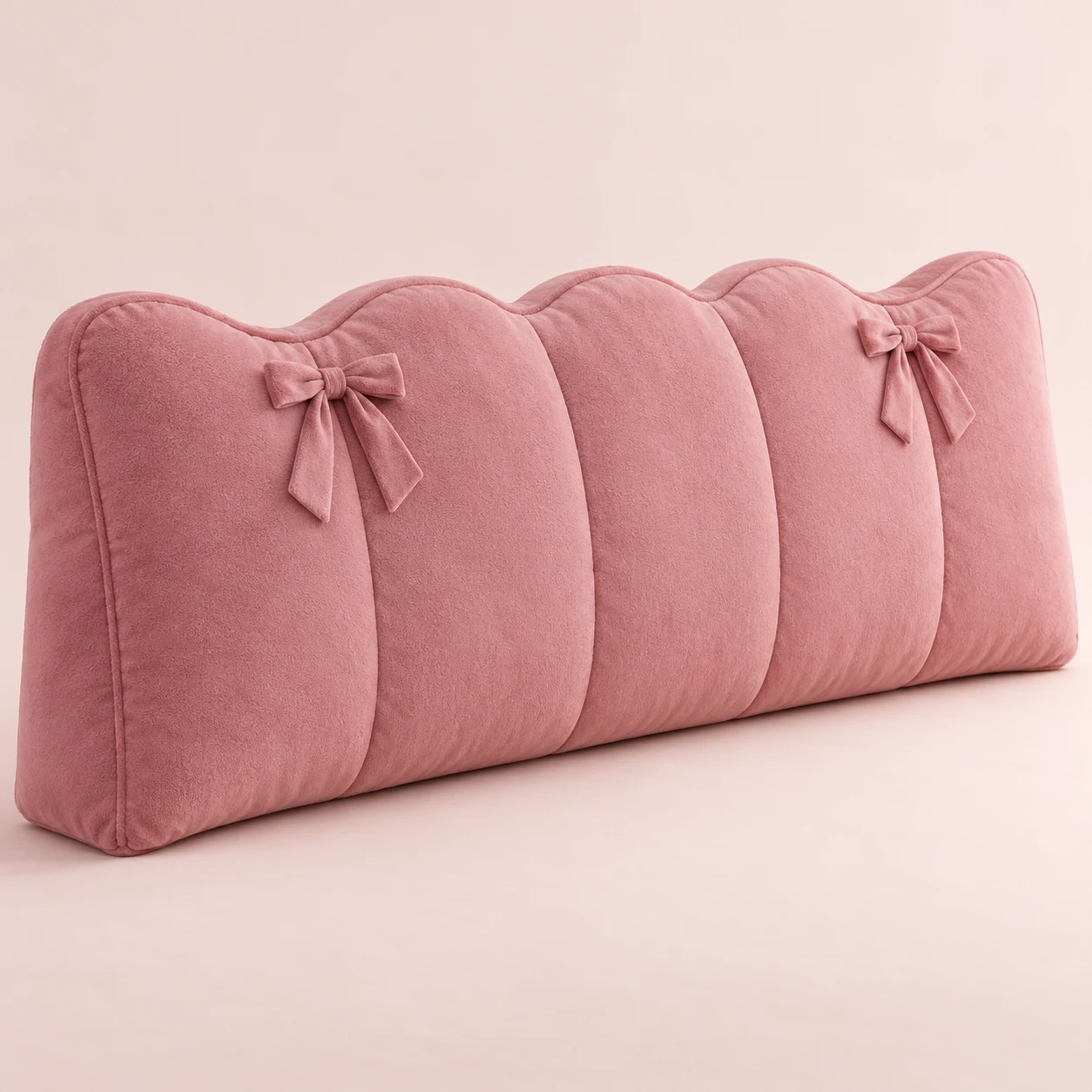Rose Ribbon, Rose plush wide bed headboard cushion with scalloped top and two small fixed sewn ribbon bows on upper front, vertical compartment seams